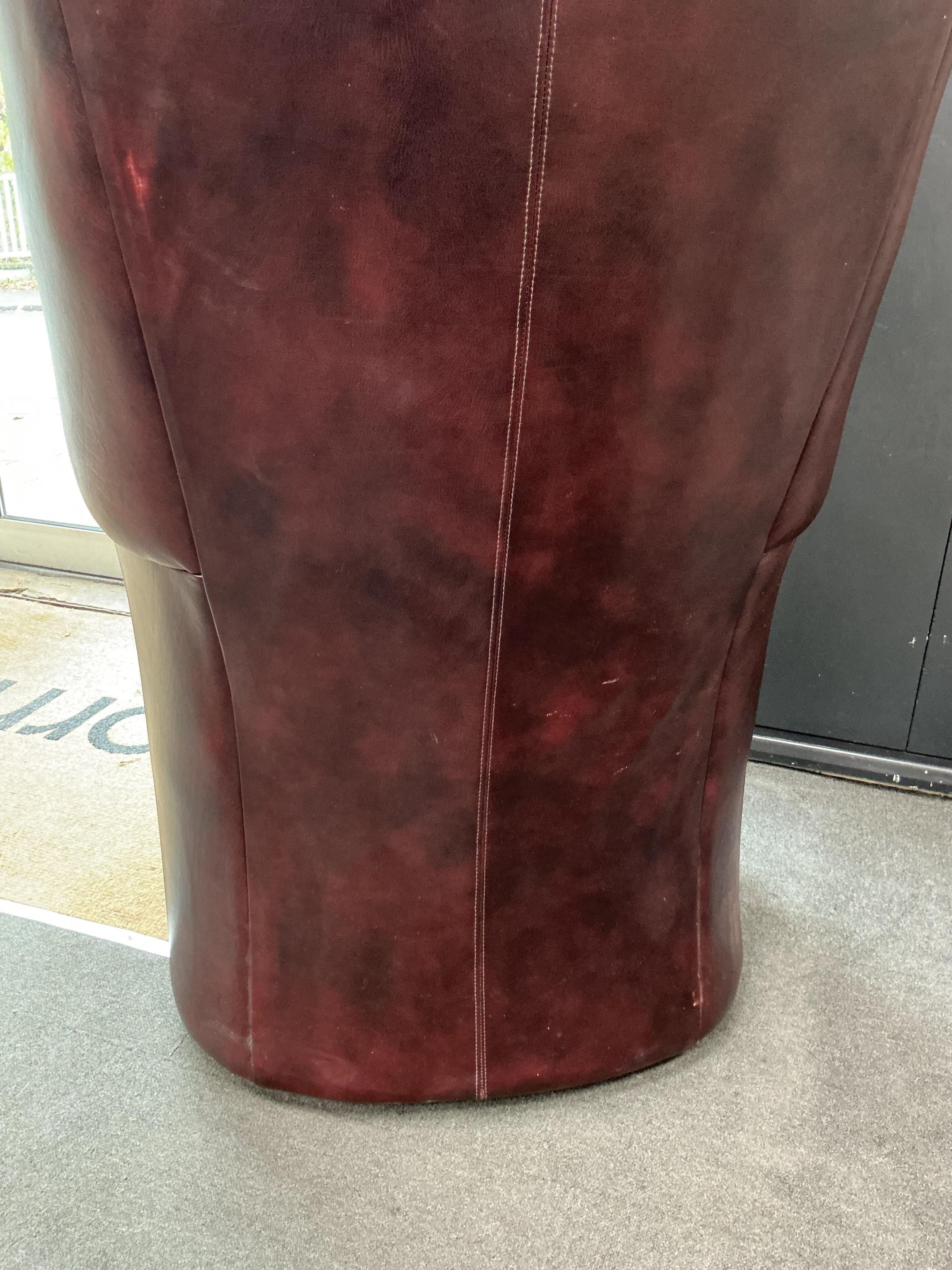 A reproduction buttoned burgundy leather hall porter's chair, width 88cm, depth 64cm, height 176cm